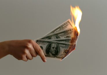 Is burning money illegal?